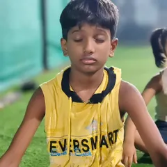 A moment of peace and focus. This young boy is deep in meditation, a practice we incorporate to help our kids build mental strength and resilience.