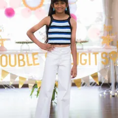 It makes my day to see happy clients like this. She’s celebrating her birthday in a custom-fit halter neck top I made for her. The striped pattern is crocheted with black, blue, and white yarn.
