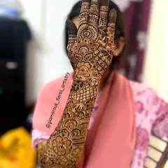 A full forearm design showcasing a cascade of flowers and vines, a popular choice for brides and bridesmaids alike.