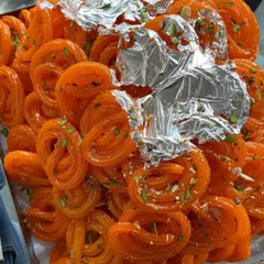 A tray of my freshly made Imarti, a dessert similar to Jalebi but with a more intricate shape. These are fried in pure ghee and soaked in sugar syrup for a delightful crunch.