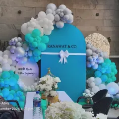 Here is the same Ranawat & Co. setup with a welcome table. This shows how the branded backdrop can serve as a functional and attractive focal point for your event entrance or registration area.