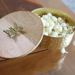 Our hammered gold box with a dual-toned wooden lid and a single butterfly accent. This piece has a warm, rustic charm while maintaining an air of sophistication.