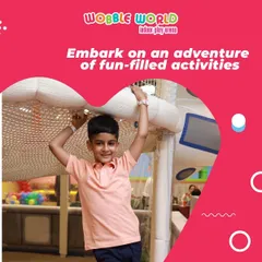 This young adventurer is navigating one of our soft play obstacle courses. These structures are designed to challenge kids and build their confidence.
