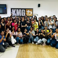 A group of empowered participants after a corporate self-defense workshop for women. We bring our training directly to your workplace, creating a comfortable and supportive environment for teams to learn essential safety skills together.