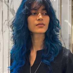 This layered blue look is edgy, modern, and full of personality.