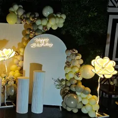 This view shows the full scope of the balloon decoration, elegantly framing the central backdrop for the 50th birthday celebration.