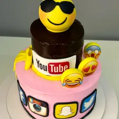 Another angle of the custom emoji and social media logo cake, highlighting the detailed fondant work and vibrant colors that make corporate celebrations unique.