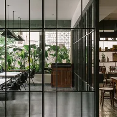 The view from our private dining area, looking out into the main restaurant space. I love the mix of the lush green plants and the clean, modern lines of the interior. It’s a calm and relaxing corner of the restaurant.