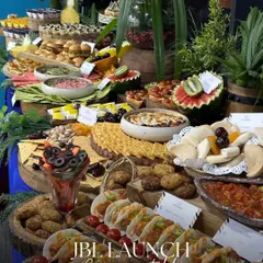 We had a great time creating this impressive grazing table for a JBL product launch. The menu was designed to be energetic and modern, featuring items like mini tacos, sliders, and fresh tarts to match the brand's vibrant identity.