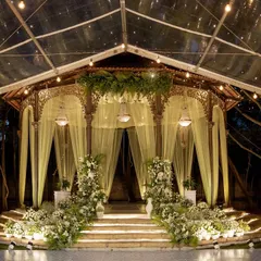 The Colonial Bandstand lit up for a spectacular Sangeet night, with a grand stage set for music and dance performances.