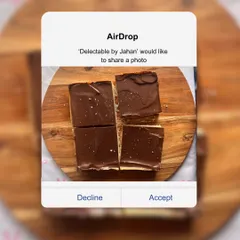 A top-down view of my Millionaire Shortbread, cut into four generous squares. This decadent treat features three distinct layers: a crumbly shortbread crust, a chewy caramel center, and a crisp dark chocolate top.