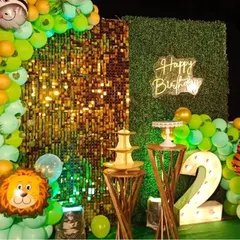 This detailed shot highlights the props, including the light-up number "2", animal foil balloons, and elegant dessert stands, all part of the cohesive jungle safari theme.