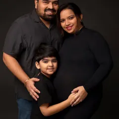 The same family in a full-color classic portrait. The rich, dark background makes their connection and happiness stand out, creating a powerful family heirloom.