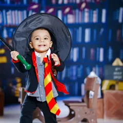 Wingardium Leviosa! We bring the magic of Hogwarts to life with our Harry Potter themed shoot. This little wizard, complete with a Gryffindor tie and wand, is ready for his adventure in our detailed library backdrop.