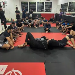 Breaking down the details of an anaconda choke. We believe every detail matters. Here, a coach demonstrates the fine points of the submission to the class.