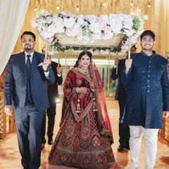 The bride's grand entrance under the phoolon ki chadar. I capture this traditional and emotional walk down the aisle with a sense of grace and importance.