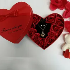 A perfect Valentine's gift, this heart-shaped box is filled with beautiful artificial roses and contains a necklace and earring set. It's a complete gift that is sure to impress.