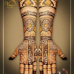 A heavy traditional design with geometric and floral patterns covering the hands and arms. The symmetry is flawless.