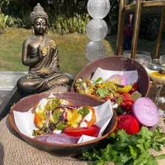 The quintessential Delhi street food, elevated. Our Aloo Tikki Chaat features a perfectly crisp potato patty, smothered in yogurt, tamarind and mint chutneys, and sprinkled with spices.