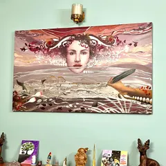 Another example of my art in a collector's home. This surrealist landscape with a central female figure brings a sense of mystery and contemplation to the space.