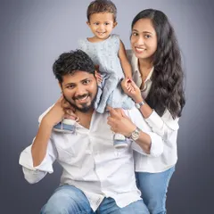 Built on laughter and held together with love. A classic family pose with dad giving his little one a ride on his shoulders.
