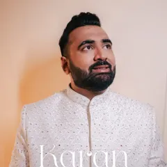 A thoughtful portrait of the groom, Karan, looking elegant in his reception sherwani.