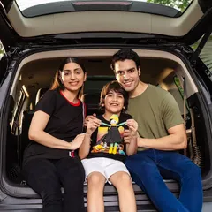 An authentic family moment captured for an MG Motor lifestyle campaign. This shot focuses on creating a relatable, aspirational scene that connects the brand with the joy of family road trips.