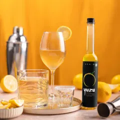 Here, the Yuzu extract is styled as the star of a home bar setup. This positions the product as a key ingredient for creating sophisticated cocktails, appealing to customers interested in mixology.