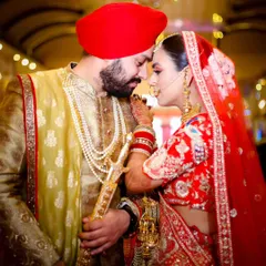 A quiet moment of connection on their wedding day. I love capturing the serene beauty of a Sikh wedding, focusing on the deep bond between the couple amidst the grandeur of the ceremony. This is a timeless portrait of love and faith.