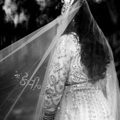 It's the personal touches that make a bridal lehenga truly yours. We customized this beautiful veil with the groom's name, a romantic and unforgettable detail for her special day.