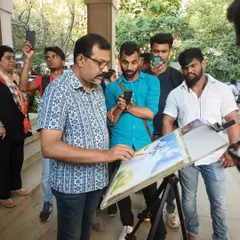 A closer look at the watercolor demo, where I am explaining my process to an engaged group of aspiring artists. I believe in making art accessible and enjoy sharing my knowledge with the community.