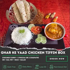 The 'Ghar Ke Yaad' Chicken Tiffin Box is pure comfort food. It comes with a hearty Chicken Curry, Dal Fry, rice, and salad, along with soft phulkas, designed to remind you of a home-cooked Sunday lunch.