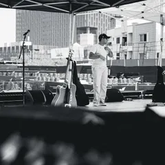A wider view of the stage during our daytime soundcheck. You can see the empty venue, a calm before the storm of the live show.