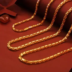 A clean and classic studio shot of intricate gold chains against a rich red background. This is an example of my e-commerce product photography, where the focus is on the product's detail and craftsmanship.