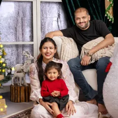 Another lovely shot of this family enjoying the festive atmosphere in my studio. The warm lighting and classic Christmas decor create a timeless holiday portrait.