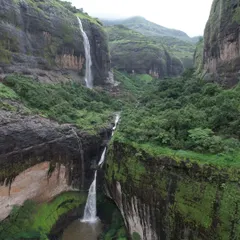 The famous Devkund Waterfall in Maharashtra, a stunning plunge waterfall that creates a beautiful turquoise pool. It's a rewarding trek to a truly magical place.