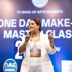 Teaching is my passion. Here I am, explaining a key technique to a large audience. My goal is to make complex makeup simple and accessible for everyone.