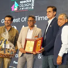 Receiving the G.O.A.T. Award on stage. It is a privilege to be recognized by my peers in the industry.