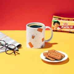 A lifestyle scene featuring the Parle-G mug. I created a classic "chai and biscuit" moment with a newspaper and glasses to evoke a sense of nostalgia and everyday comfort.