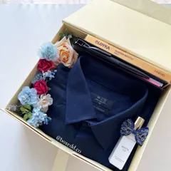 A Father's Day gift box with a classic blue shirt, perfume, and almond brittle. A simple and thoughtful way to show dad you care.