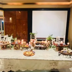 We create an elegant and festive atmosphere for Diwali card parties. This beautiful table setup features a variety of our appetizers and desserts, illuminated by the warm glow of candles.
