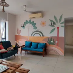 A finished living room featuring a custom Boho-style mural. The design uses a warm, earthy pastel palette with abstract landscape elements and tropical plants to create a relaxed and sunny vibe.