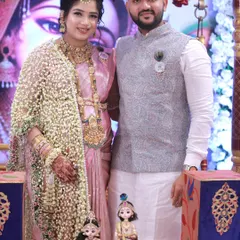 A beautiful couple posing with our gender reveal doll setup before the guessing ritual begins at their baby shower.