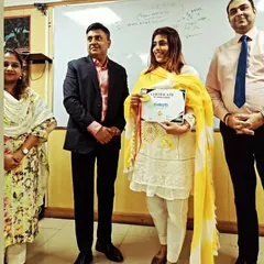 Holding a certificate of achievement alongside my colleagues. Success in the legal field is often a team effort, and I am grateful for the supportive professional environment I work in.