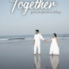 A beautiful reflection shot of a couple walking hand-in-hand on a wet sandy beach in Goa, edited to look like a romantic movie poster.