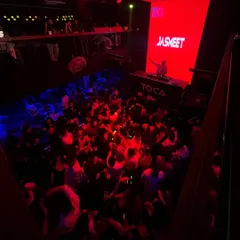 A bird's-eye view of a packed dance floor at Toca, Bangalore. The energy from a full house under the red lights is something else.