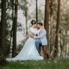 A romantic moment in the woods. Our light blue two piece gown with a ruffled tulle skirt is perfect for a fairytale themed pre-wedding shoot.
