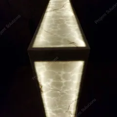 Detail is everything. This image highlights a custom-fabricated bar counter with backlit onyx, adding a touch of luxury and a warm, inviting glow to the back of the theater room.