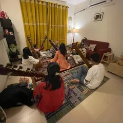 An overhead view of our group sitar class. It's a joy to see students of different ages and backgrounds sitting together, united by their love for music. These sessions are about learning, sharing, and growing together.