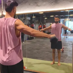 This is a snapshot of my own journey, working on lateral raises to build shoulder strength. My transformation from 92kg to 83kg was built on consistency with exercises like these, a clean diet, and 8-10k steps daily.